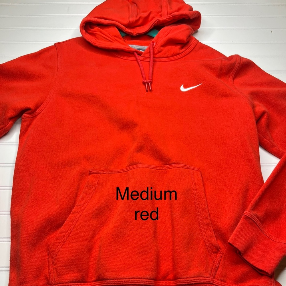 medium size. Nike. red sweatshirt.